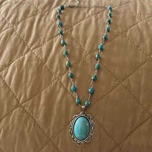 Costume Turquoise Necklace with turquoise large stone hanging.